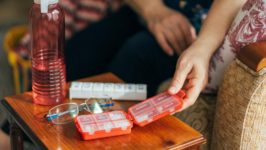 Pill organizer on a table