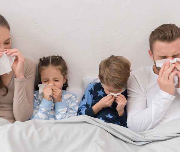 A family in bed with the flu