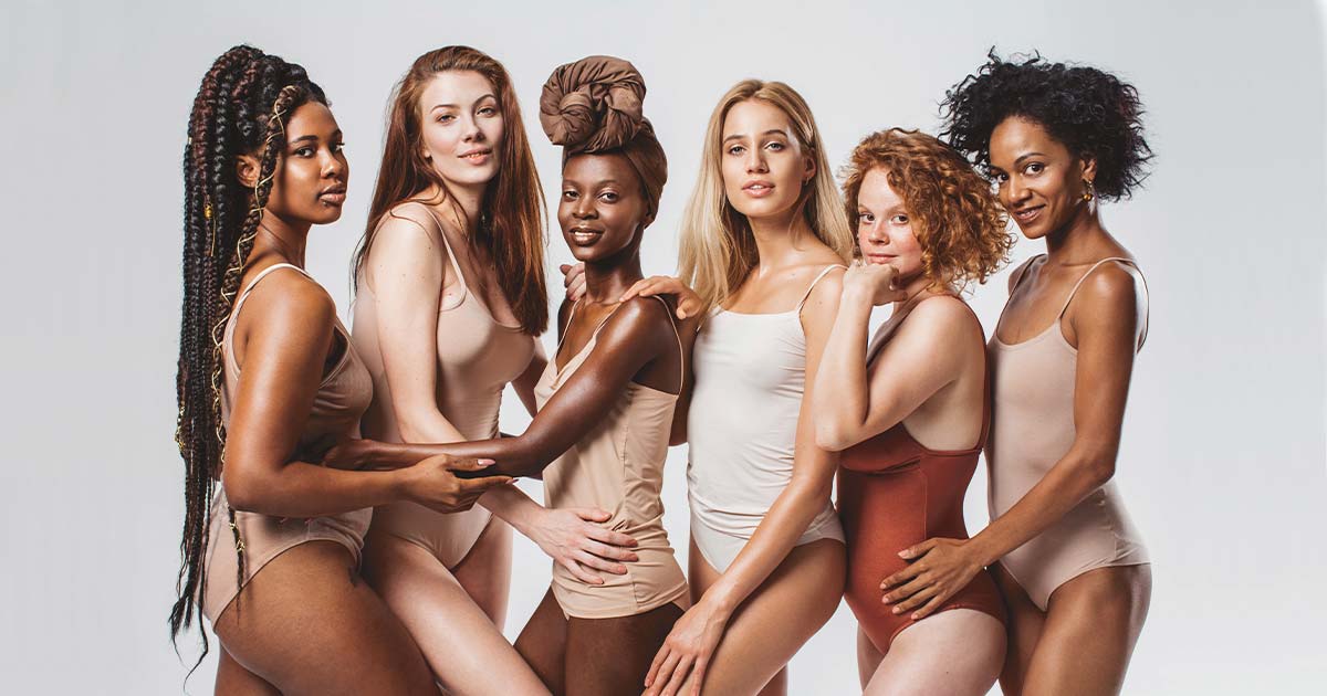 Diverse crew of women in nude-coloured body suits