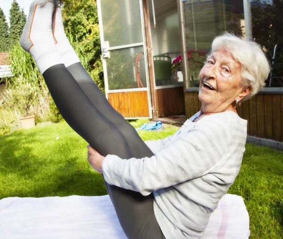 Elderly woman loving yoga!