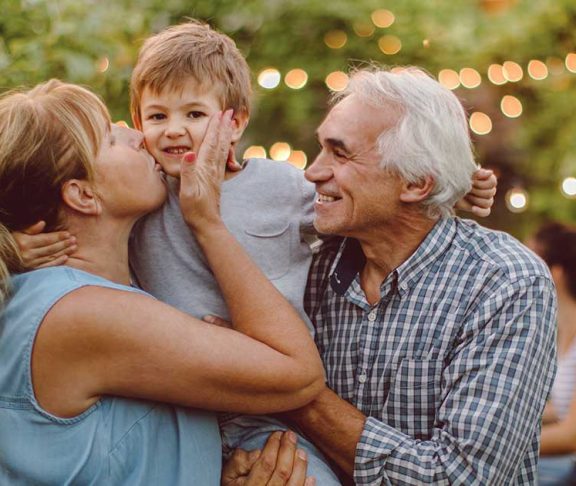 Grandparents having fun with their grandchild at an event