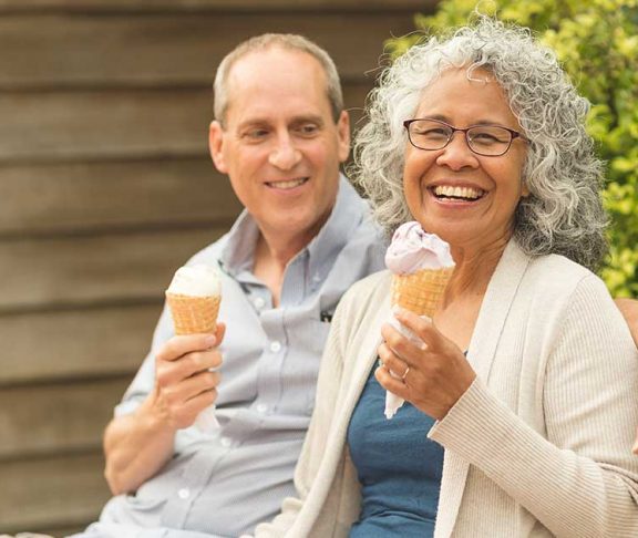 Happy seniors eating ice cream