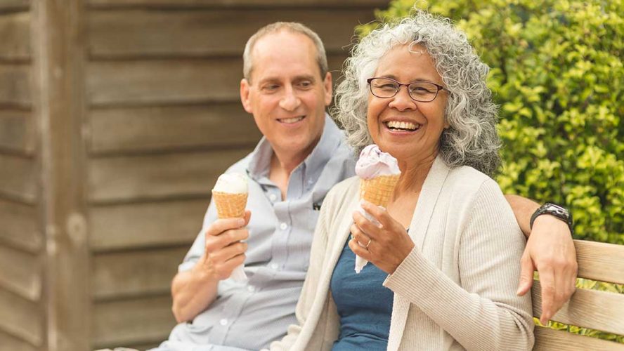 Happy seniors eating ice cream