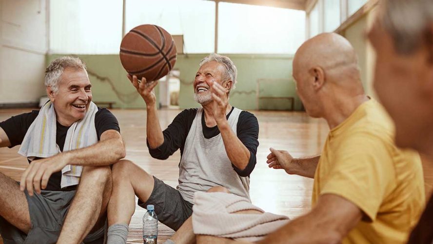 Senior men playing basketball