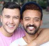 Smiling gay couple
