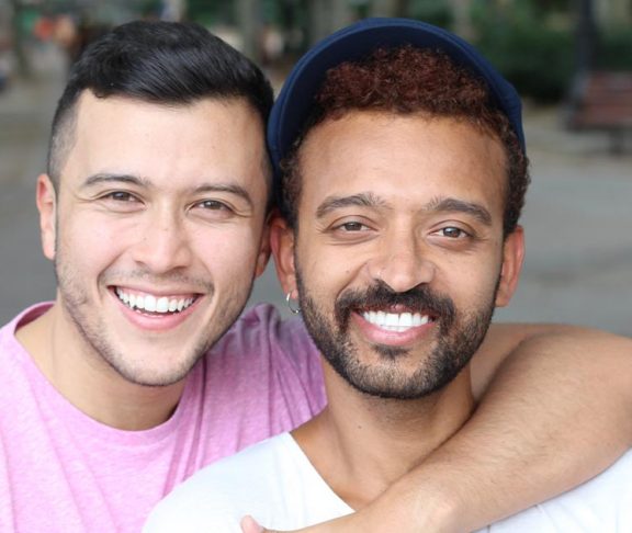 Smiling gay couple