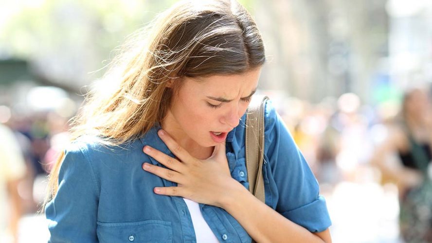 Woman having breathing troubles