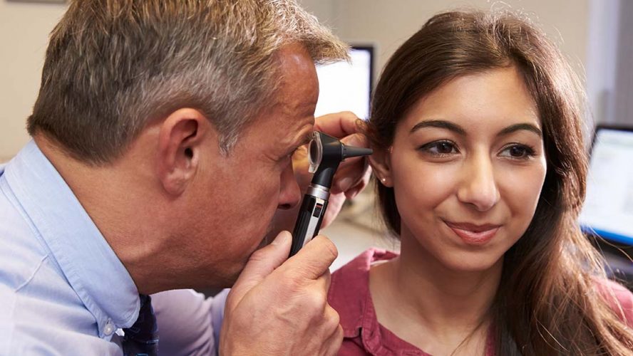 Young woman in an ear exam