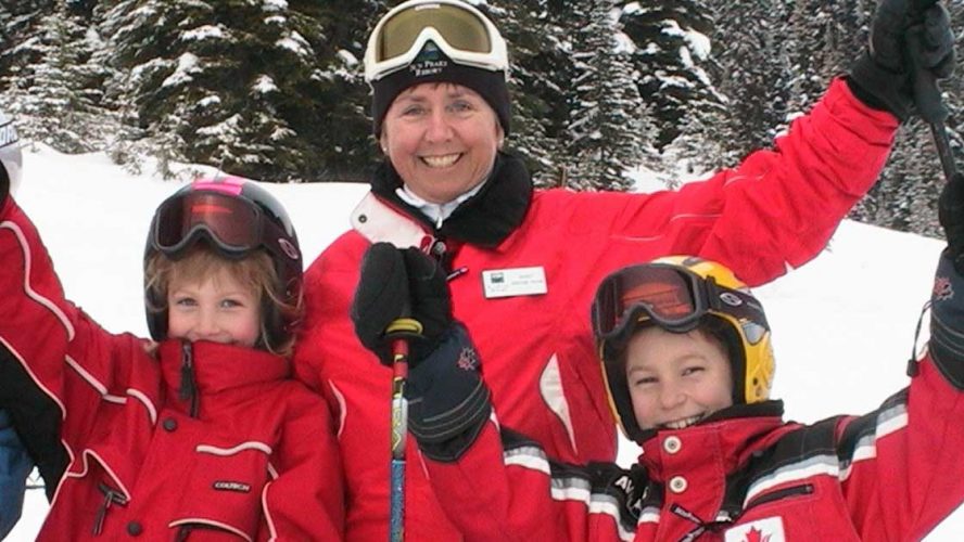 Nancy Greene Raine with two other young skiiers