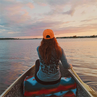 Jennifer Gauthier on a lake at sunset