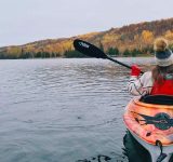 Woman kayaking on a lake