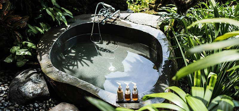 Outdoor stone bath in tropical resort