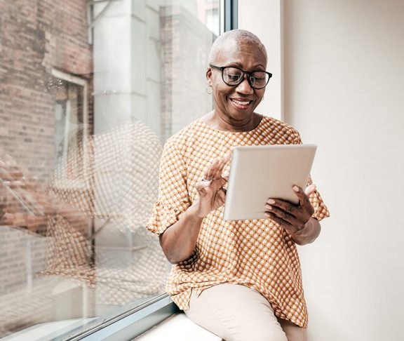 Senior woman using a digital tablet at home