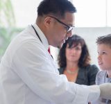 Young boy getting a vaccination at a doctor's appointment