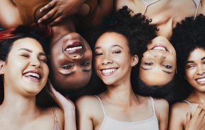 5 girls showing their healthy and beautiful smiles for the camera
