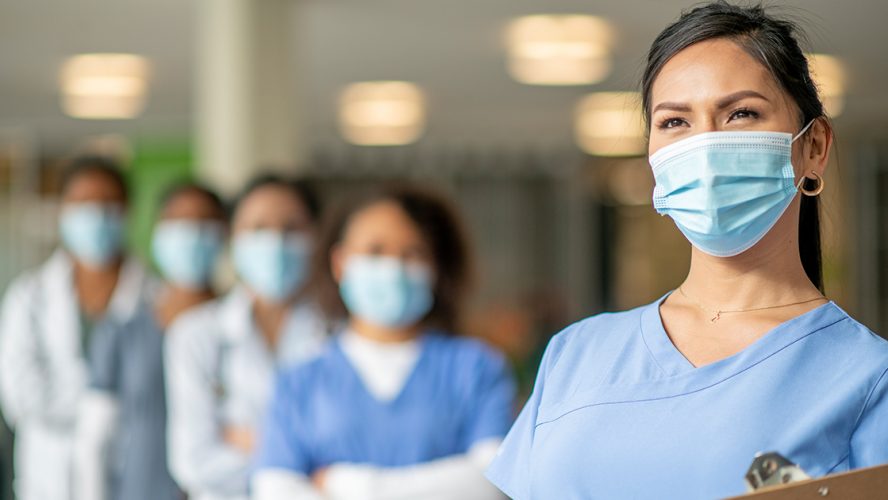 A group of female healthcare professionals with masks on