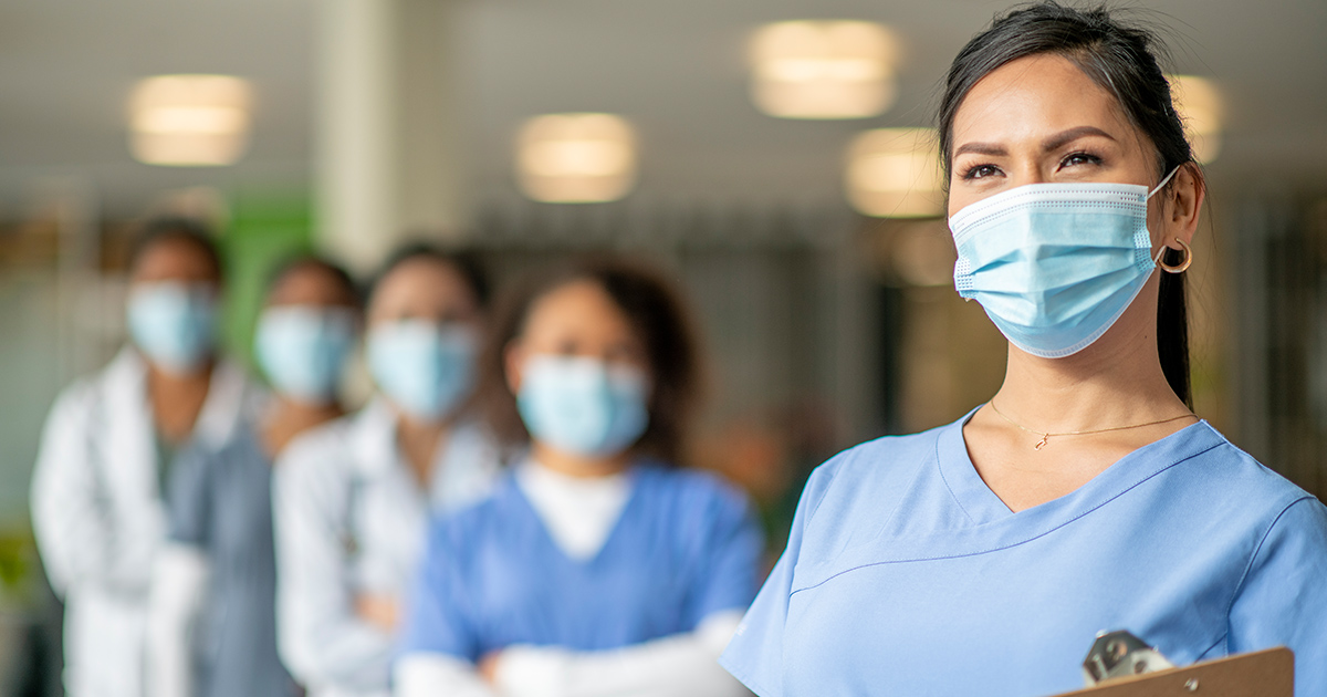 A group of female healthcare professionals with masks on