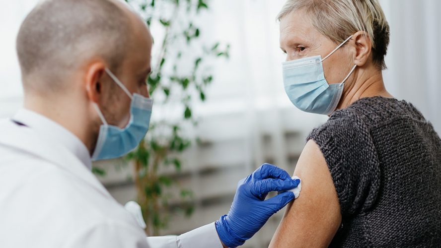 woman getting vaccine shot 411