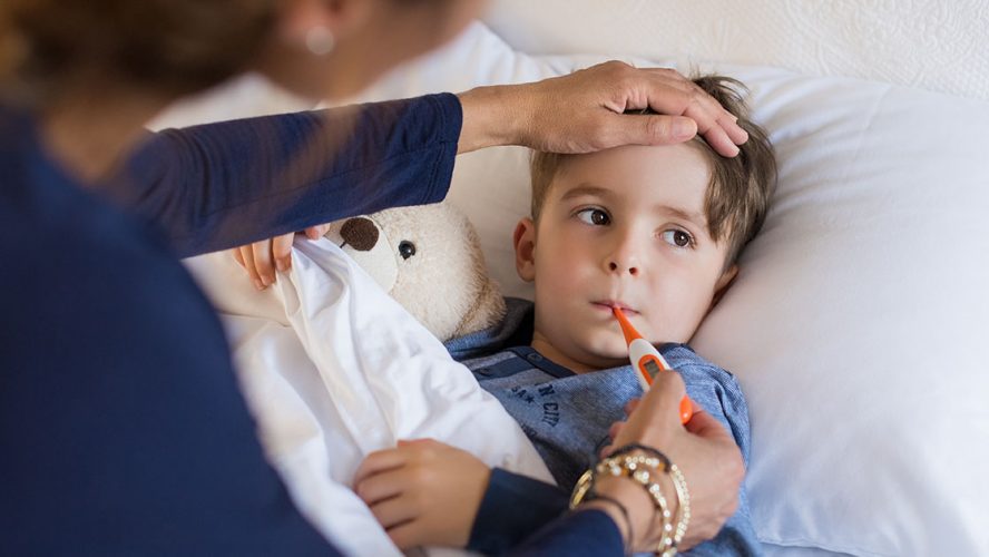 young boy sick thermometer immunize canada