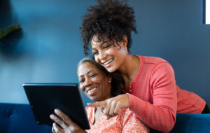 african american mother daughter tablet