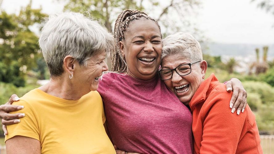 older women smiling laughing