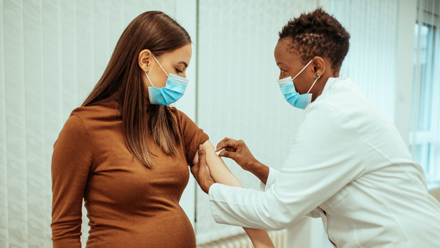 pregnant woman getting vaccinated