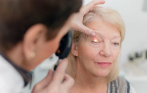 elderly woman getting eye test