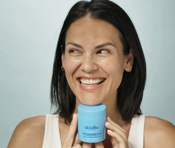 woman smiling with skinfix cream