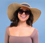 woman wide brimmed hat and sunglasses