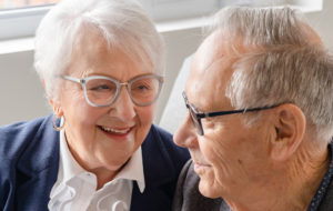 elderly couple smiling together
