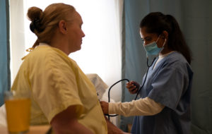 Nurse checking patient