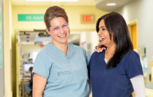 two nurses standing beside eachother