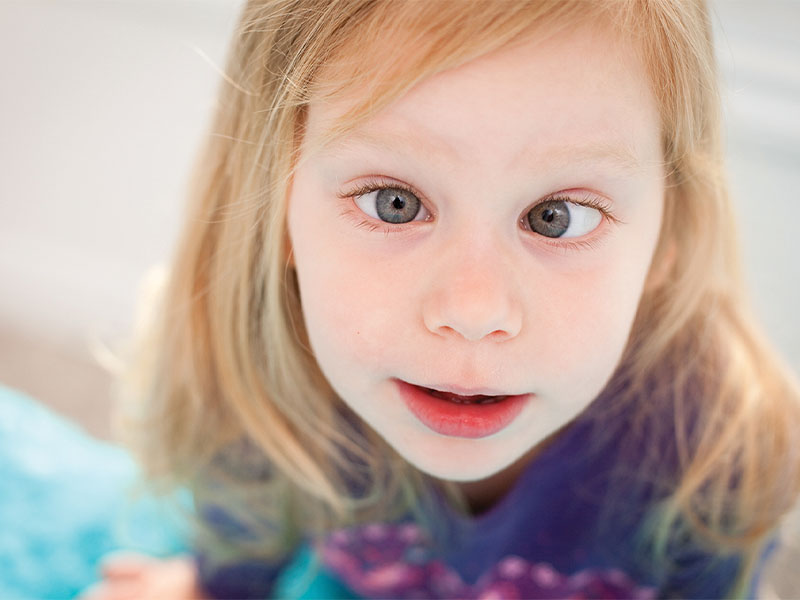 A close up of a young girl with sight loss.