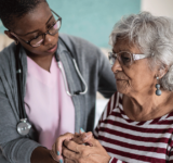 Doctor supporting patient with dementia
