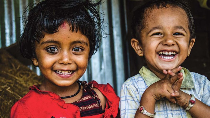 Two smiling young girls in South Asia