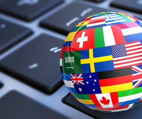 Render of a globe made of flags sitting on a keyboard