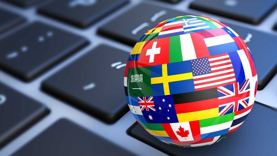 Render of a globe made of flags sitting on a keyboard