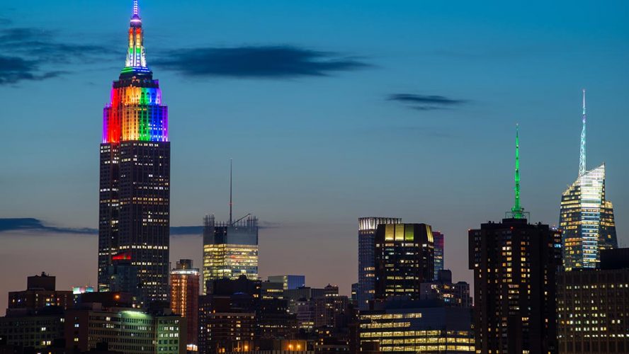 The Empire State Building lit up with a Pride rainbow