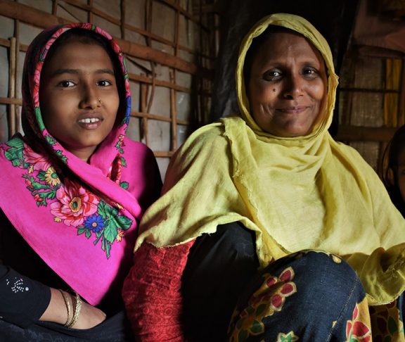 Rohingya refugee Ayesha with her daughters in her shelter in the camps in Cox's Bazar, Bangladesh.