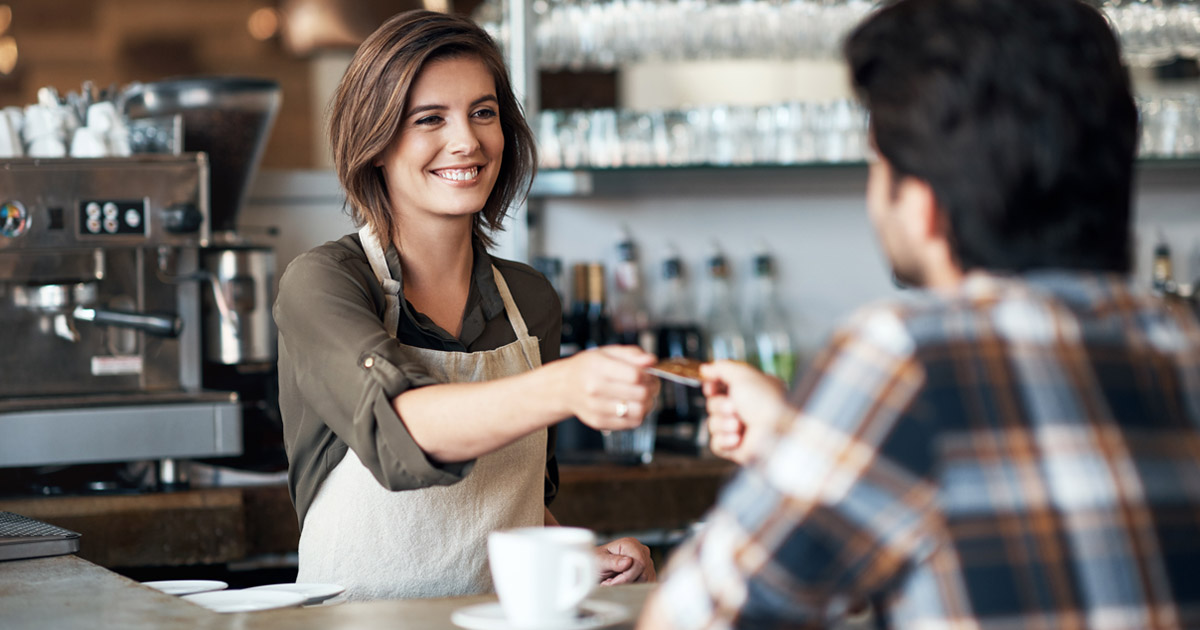 Barista happy to take customer's card for payment