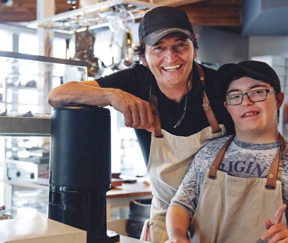 Two men who own a small business, one has Down syndrome