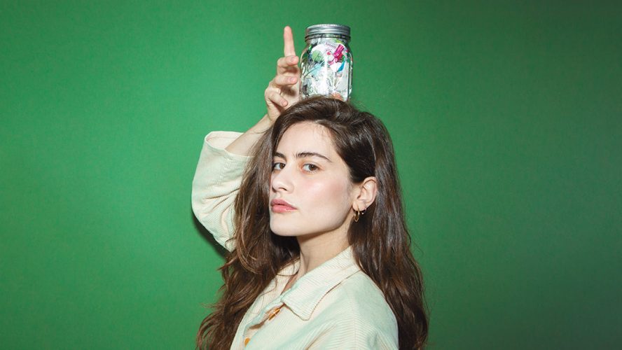 Lauren Singer posing with a mason jar on her head