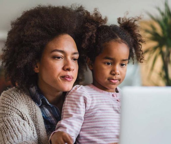 Mother and daughter using a computer