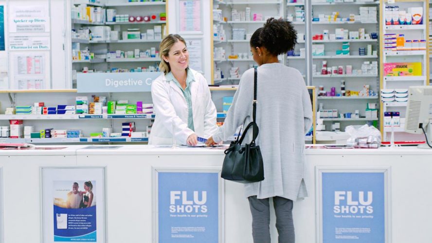 Pharmacist helping client