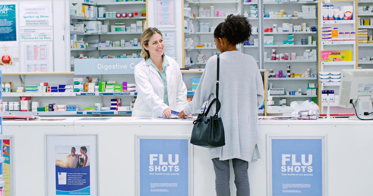 Pharmacist helping client