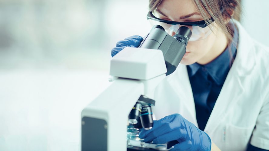 woman scientist microscope stem