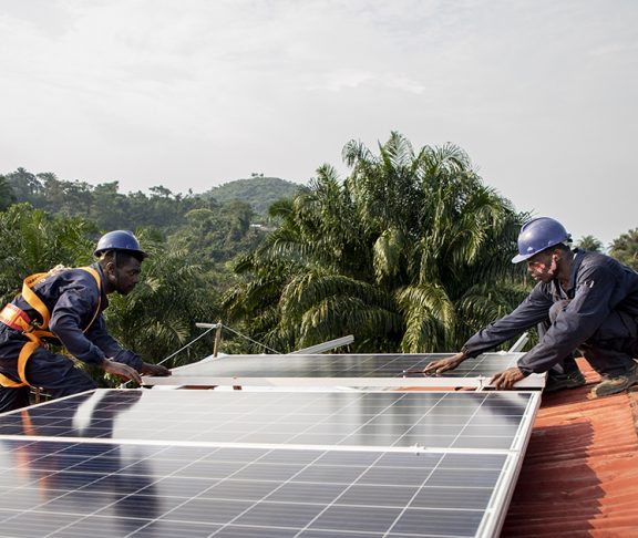 Header - Workers placing solar panel