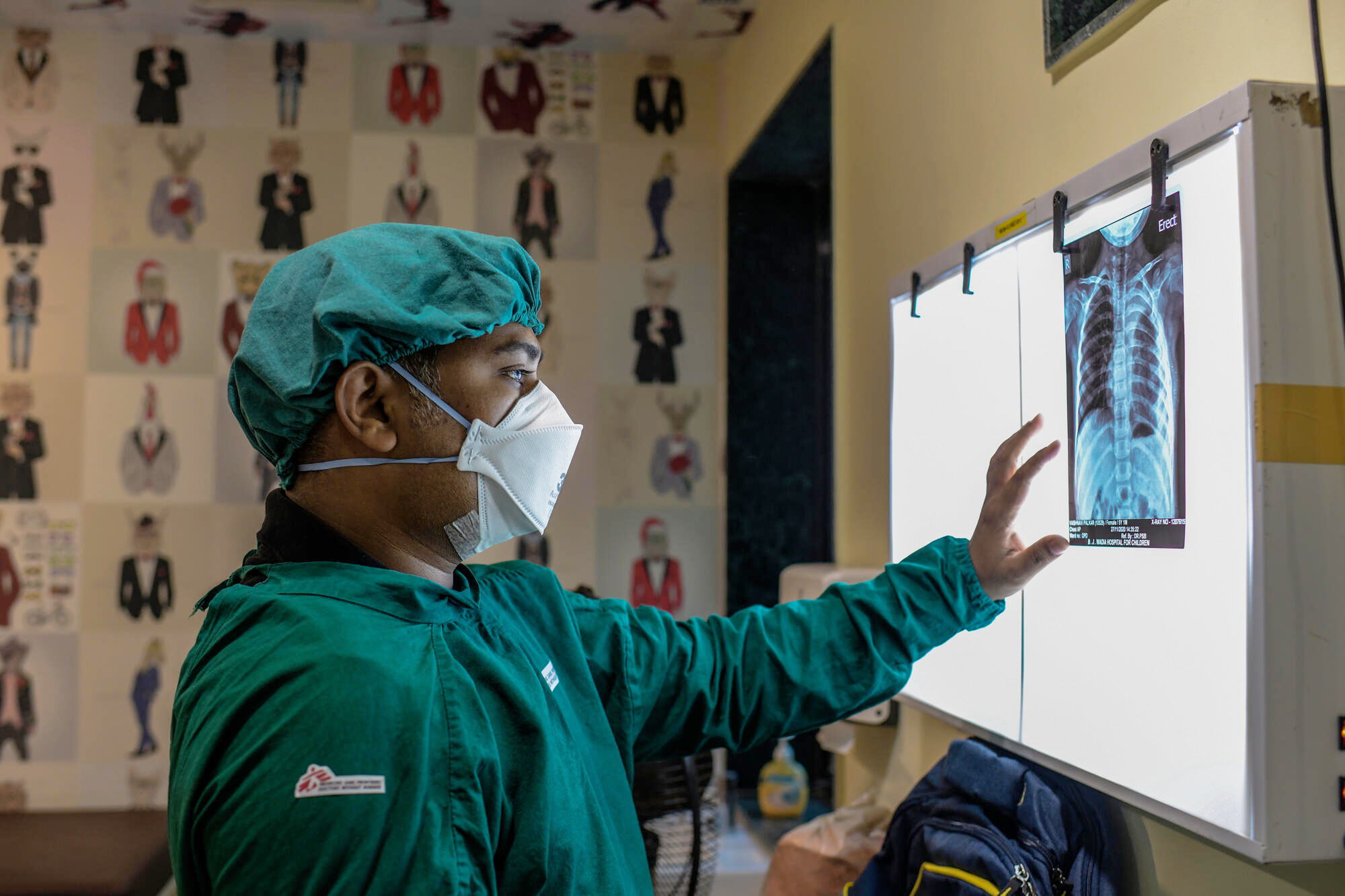 MSF Medical Doctor Interpreting Chest X-Ray of six-year-old MDR TB girl patient