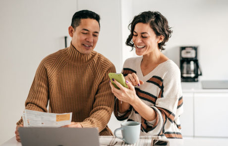 couple lookating phone mortgage