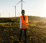 engineering company worker walks on wind farm